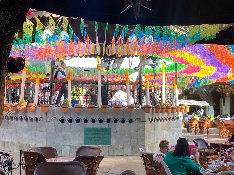Mariachi band playing in a decorated rotunda in Tequila.