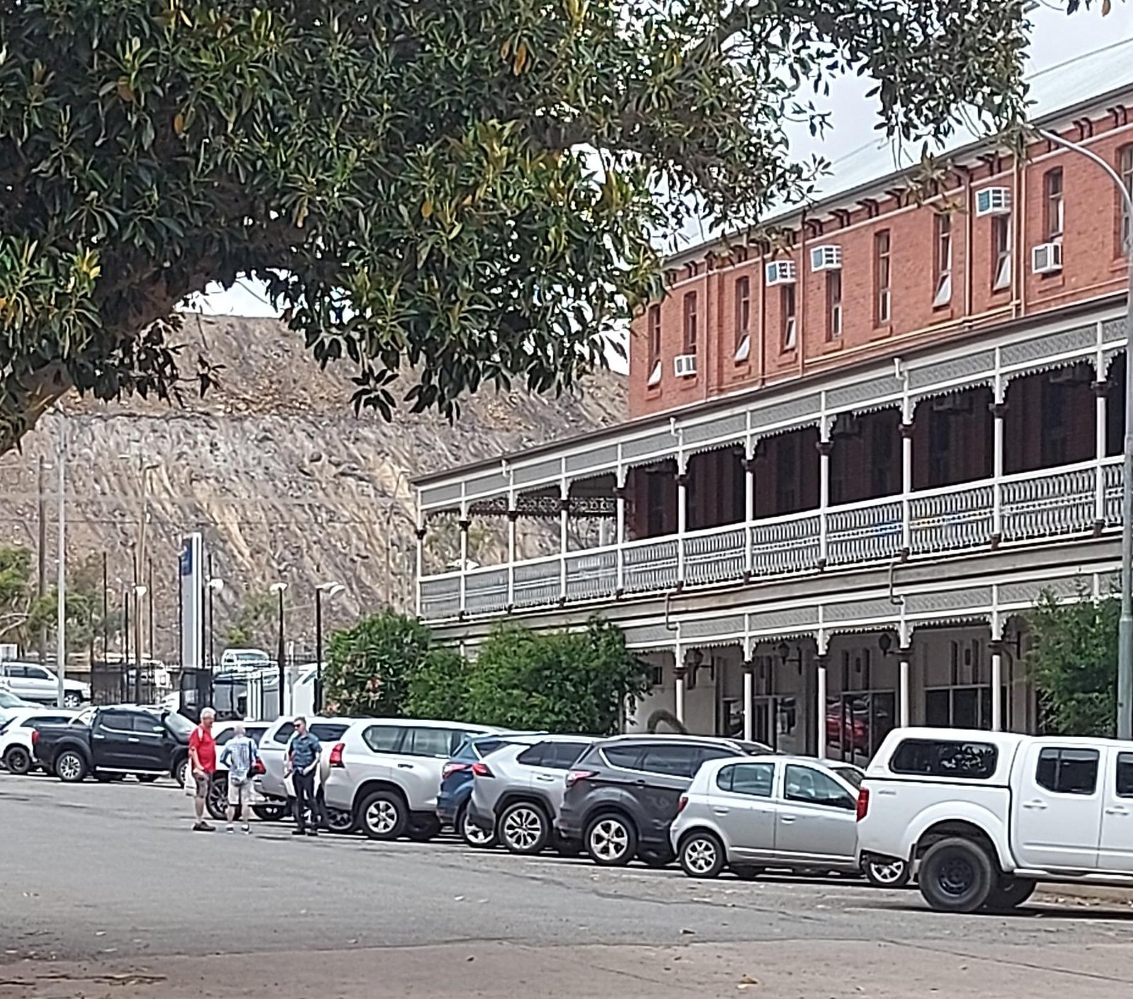 Broken Hill, NSW.  Outside the grand old Palace Hotel with the pile of rocks from the Junction Mine in the background.