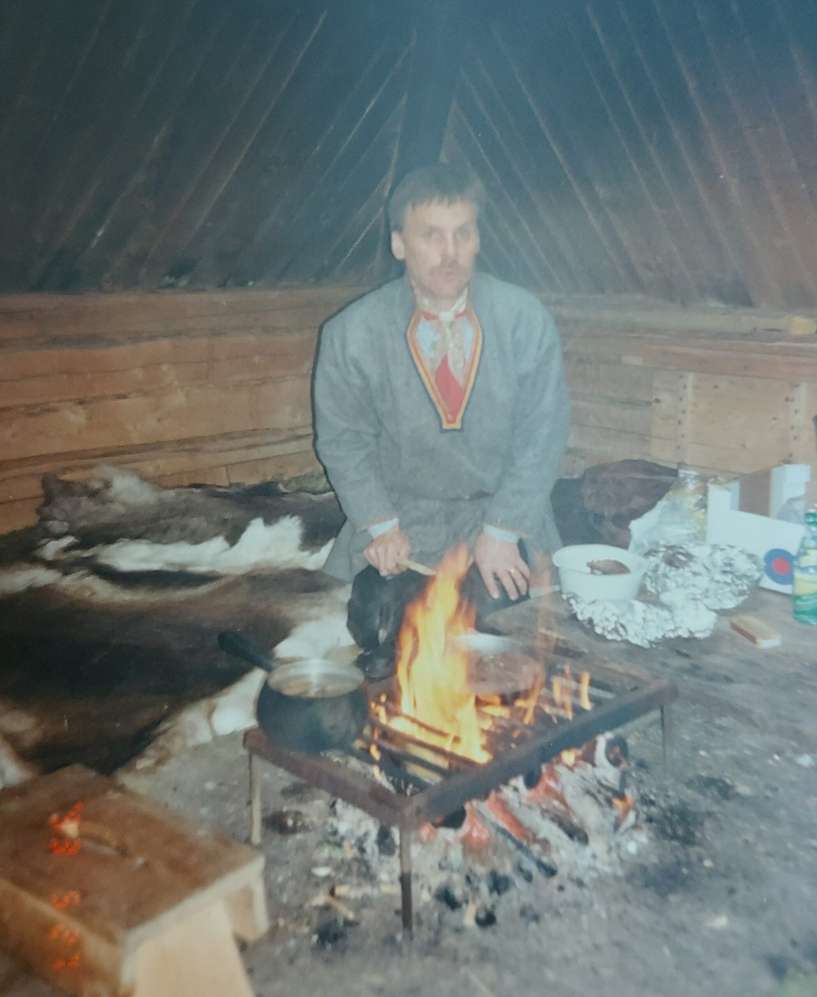 Inside the Derwent Bridge hotel. Cavernous ceilings and no insulation are mitigated by the log fire.