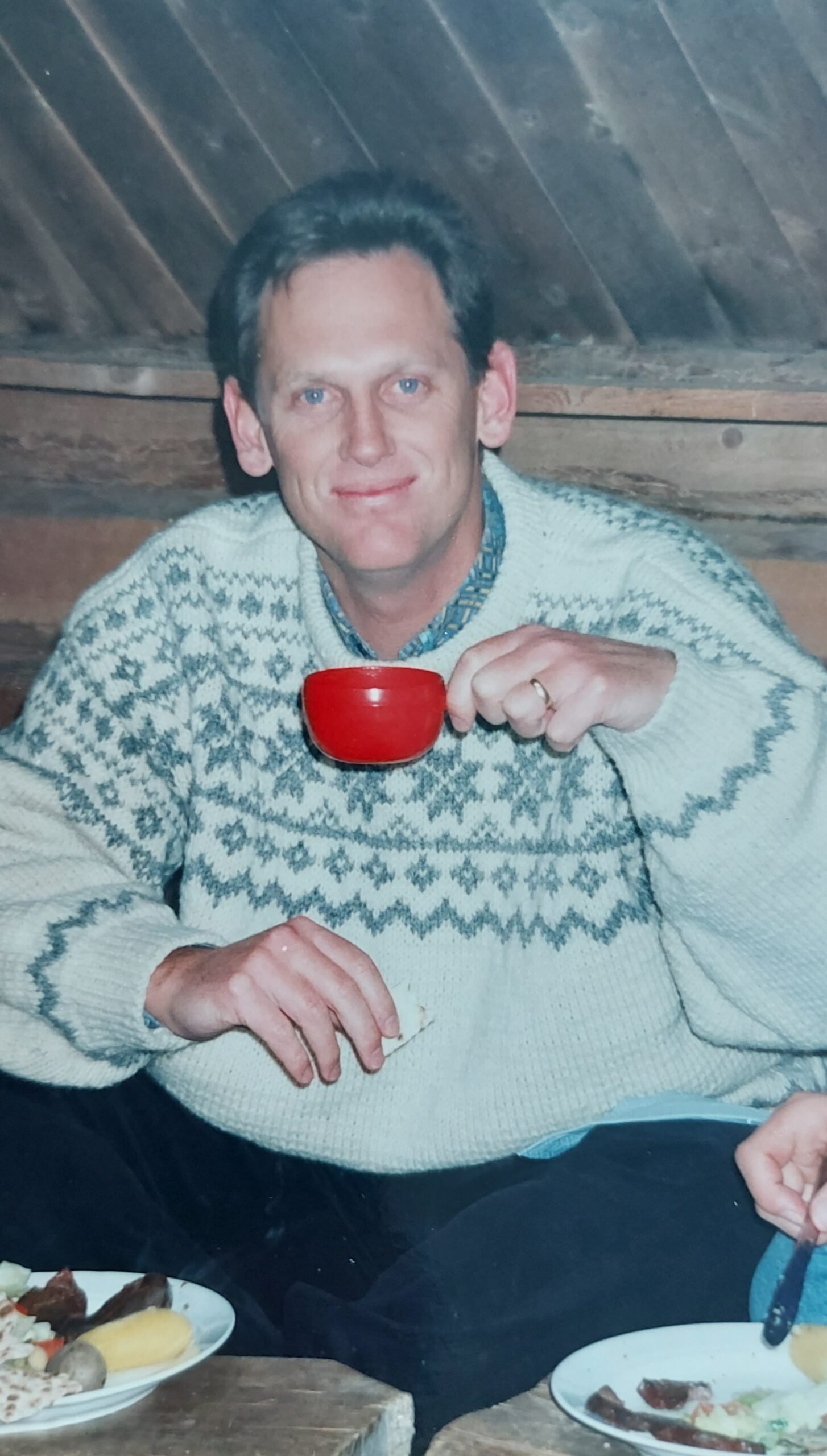 Inside the Derwent Bridge hotel. Cavernous ceilings and no insulation are mitigated by the log fire.