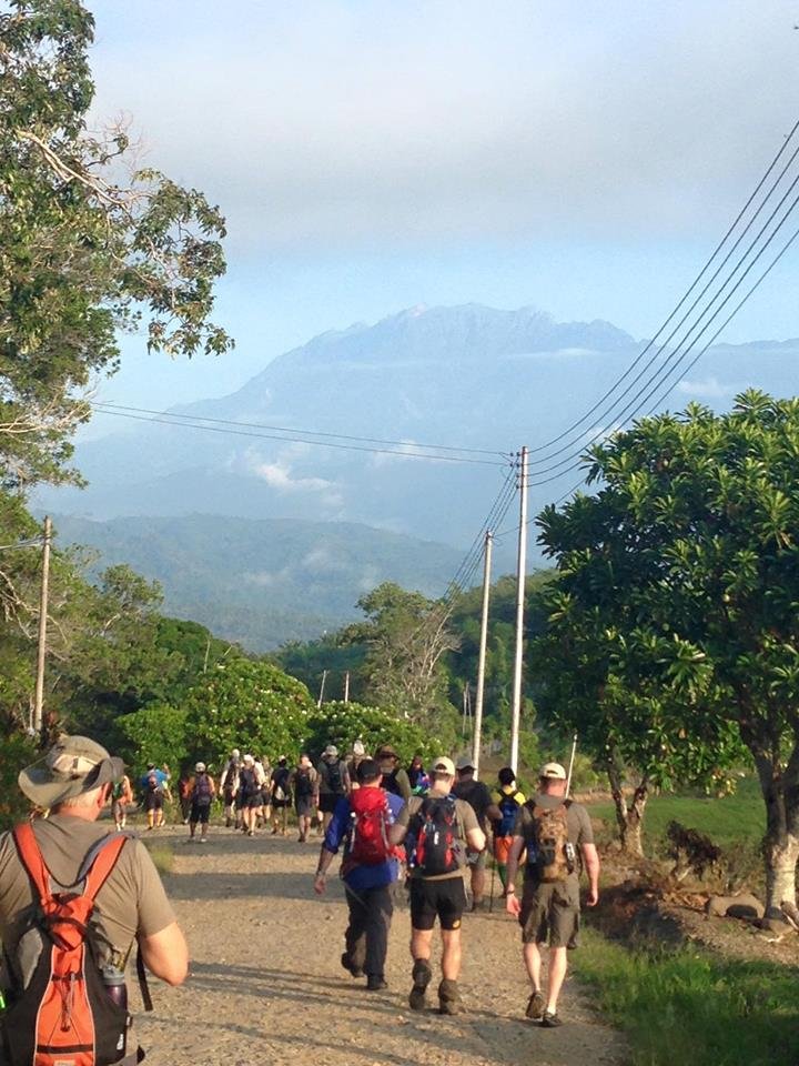 Stepping off on the Sandakan Death March trail with Mount Kinabalu in the distance.