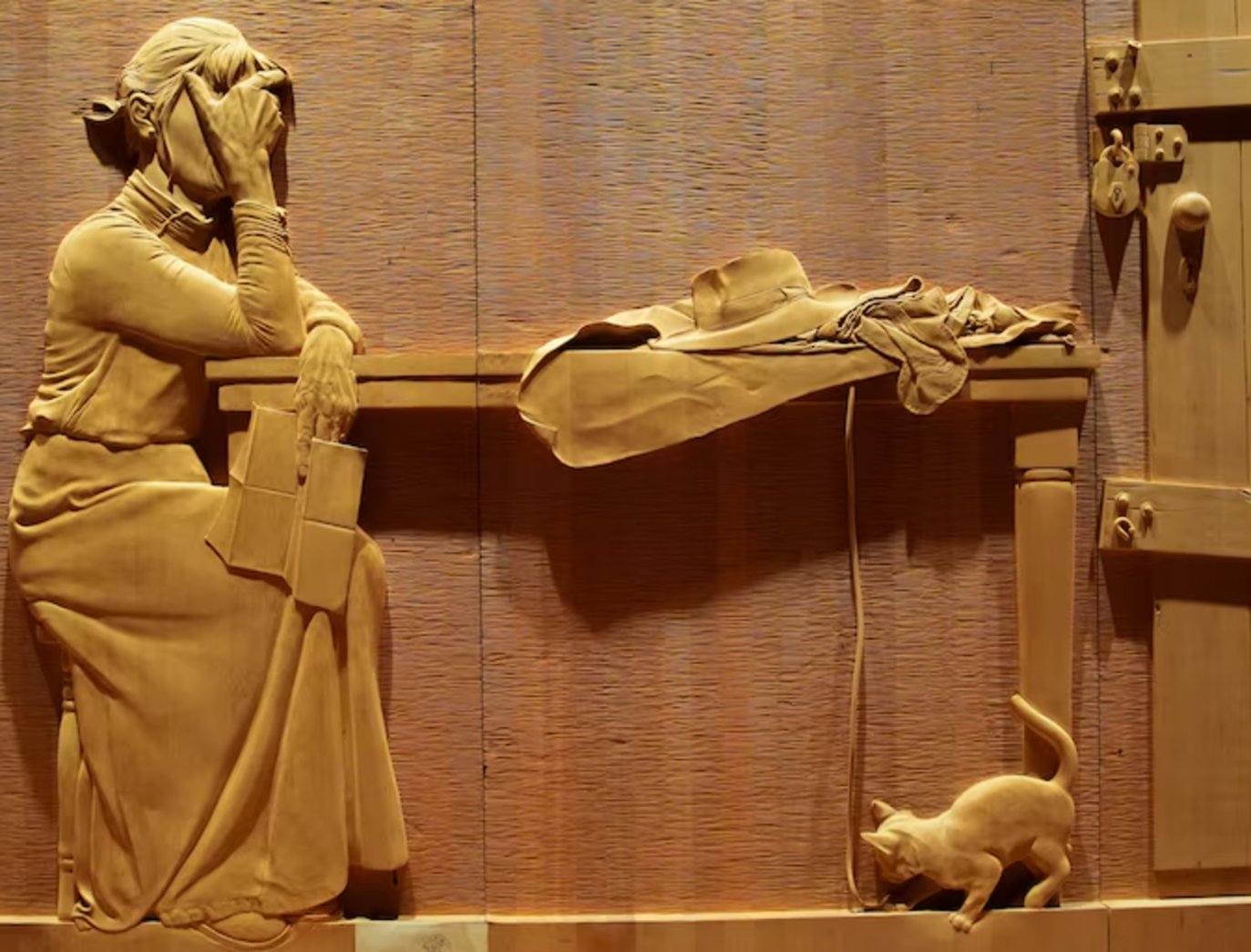 The intricate detail of the Wall in the Wilderness, Tasmania. In this carving, a woman finds out her husband has died. Source: ABC.