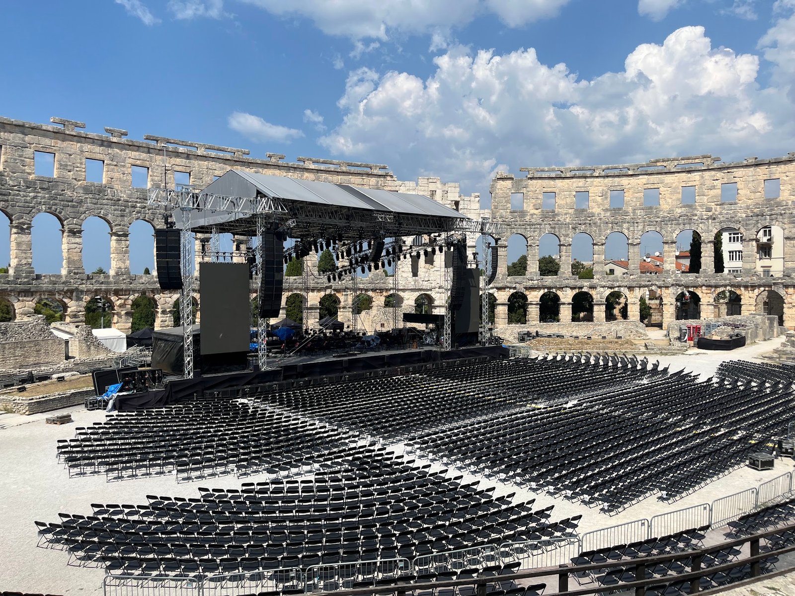 Getting ready for a concert in Pula Arena, Croatia.  This view is to the west (the downhill side) and the walls are noticeably taller than on the uphill side.