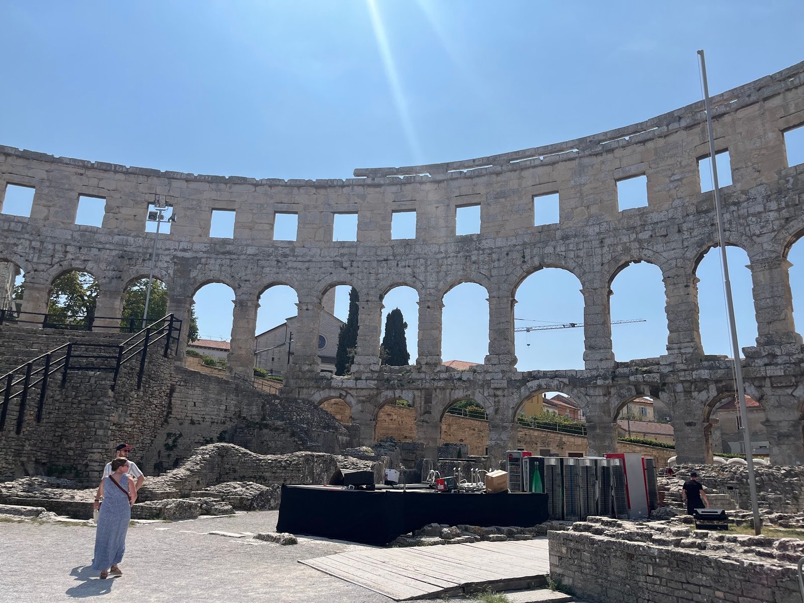 Old meets new in Pula Arena, Croatia. Vending machines and concert paraphernalia amongst the limestone ruins.