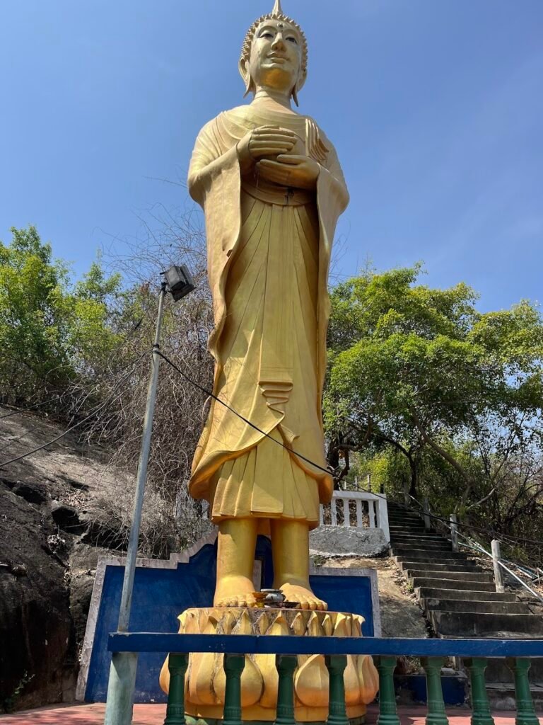 Buddha at Wat Tham Khao Tao, near Hua Hin, Thailand. He faces northward out to sea. His gesture (mudra) is one of offering - he is holding a small bowl.