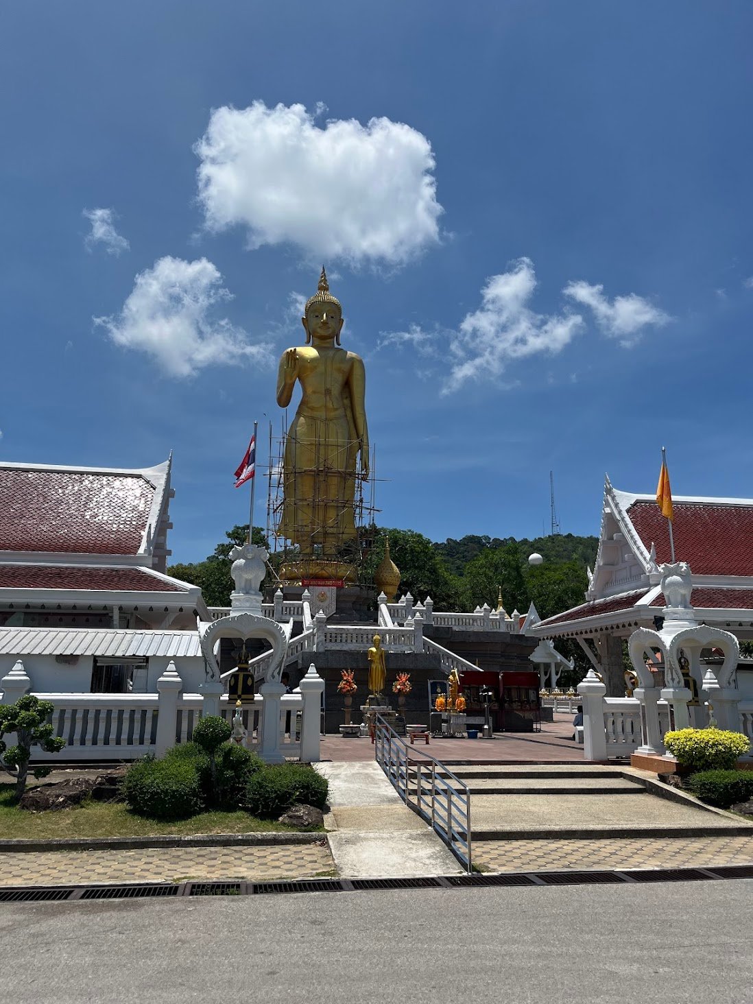 Buddha under constant maintenance above Hat Yai, Thailand.