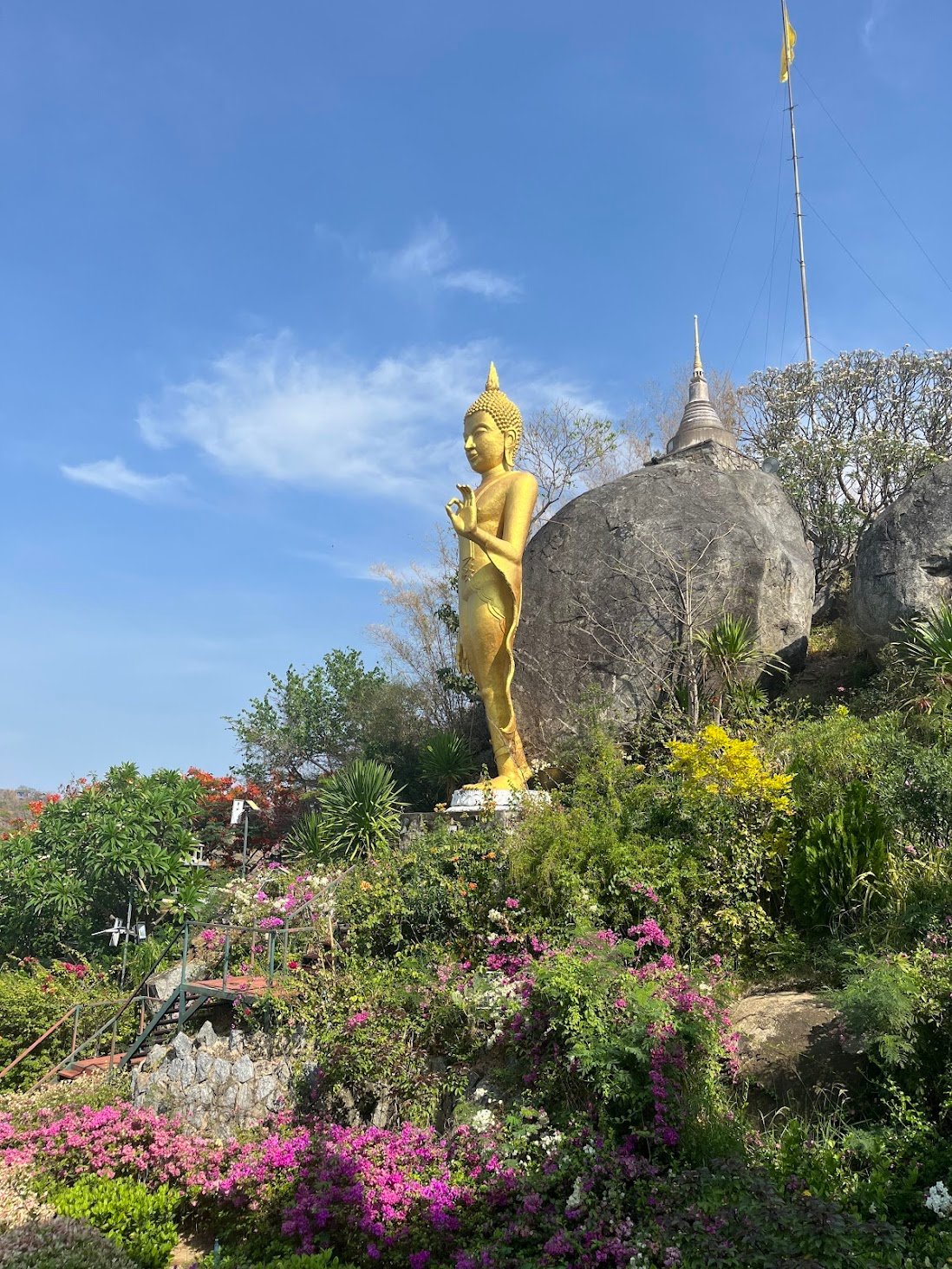 Buddha by the bay at Bo Thong Lang near Bang Saphan, Thailand. His gaze captures families swimming in the ocean, as well as local squid fishermen. And if he cranes his neck, he might see the industrial port not far away.