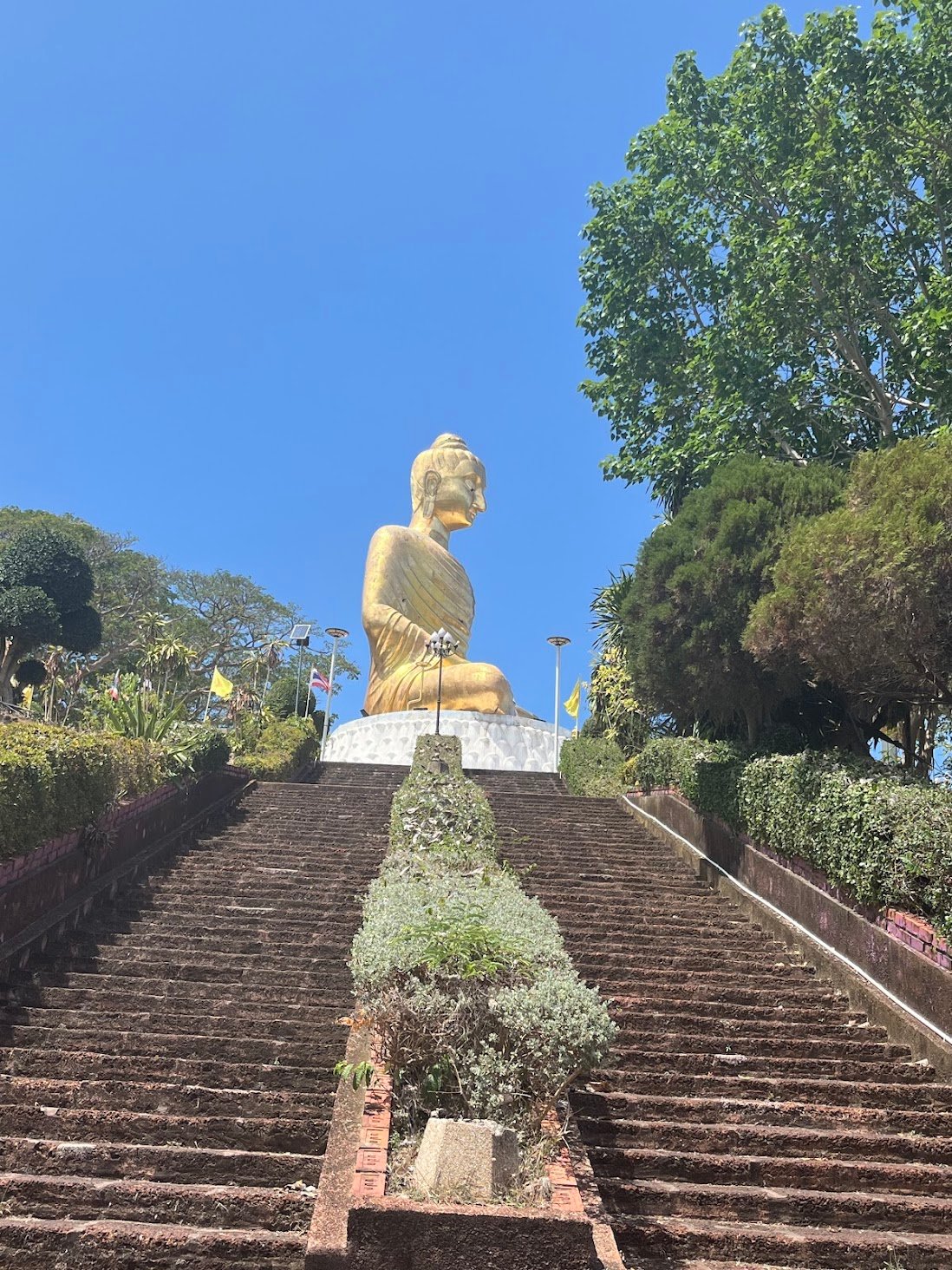 Giant seated Buddha staring out to the east and south at Phra Maha Chedi Phakdi Phrakart, near Ban Krut, Thailand.