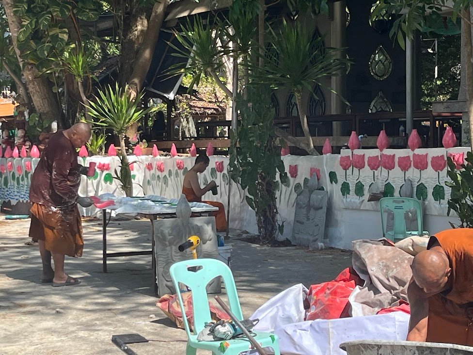 Monks working at Wat Thang Sai, Ban Krut, Thailand.