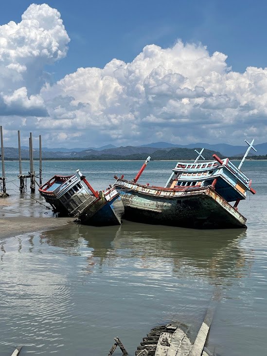 Old fishing boats near Bo Thong Lang Bay, Prachuap Khiri Khan, Thailand.