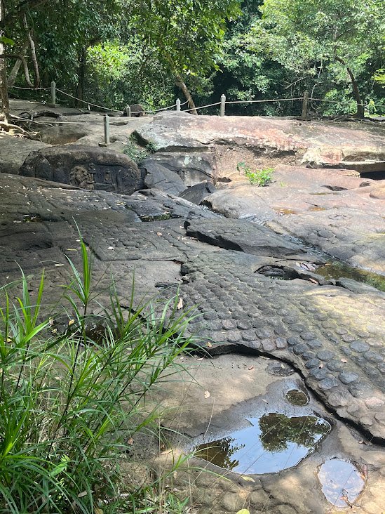 Some 12th century rock carvings at Kbal Spean waterfall, Cambodia in the dry season.