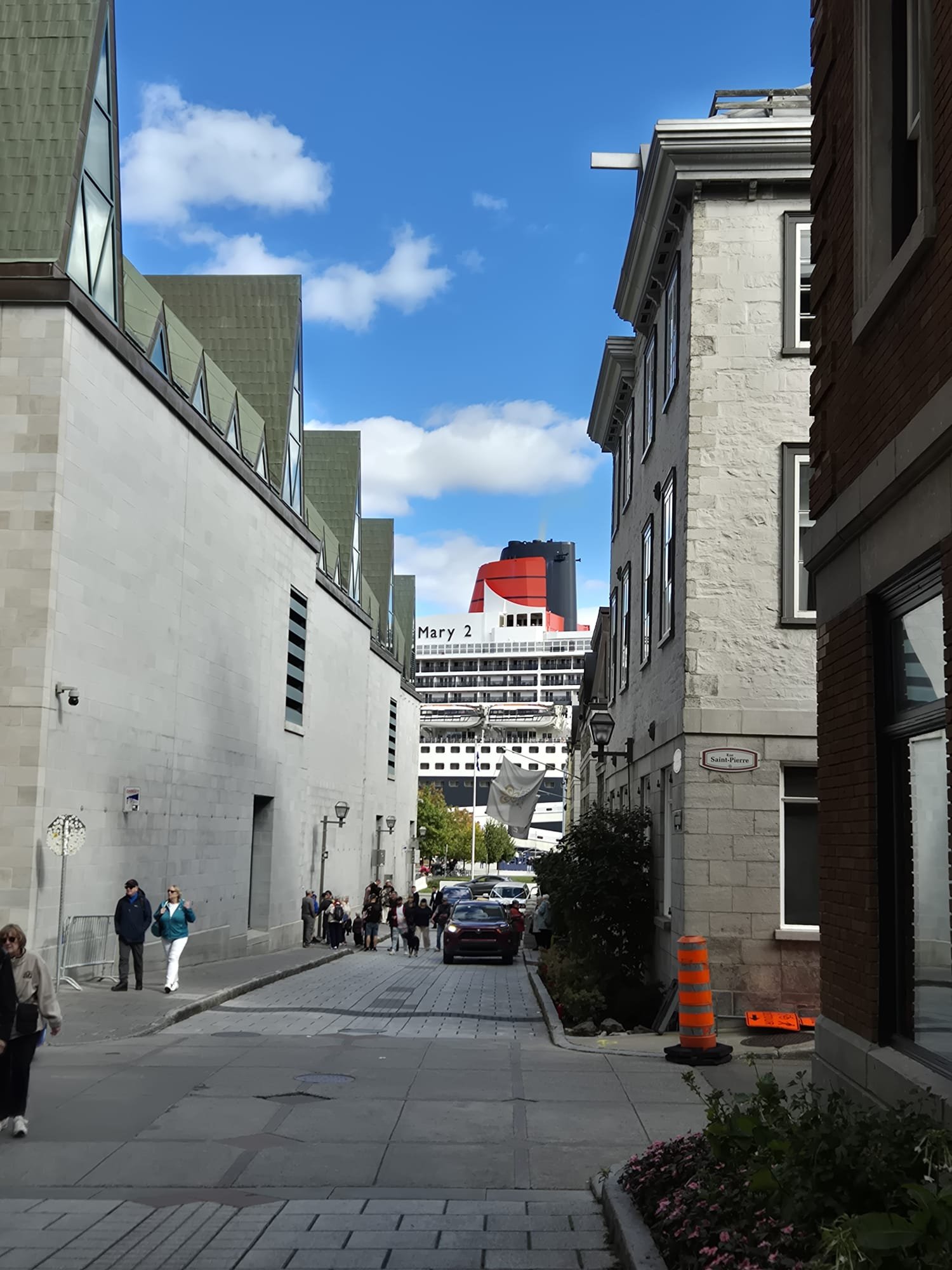Old city Quebec, October 2026. The Queen Mary 2 looms from the port below.